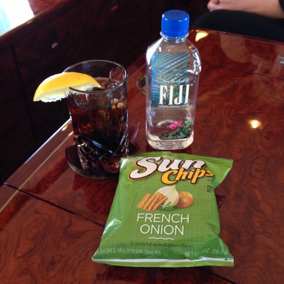 Drink service of diet coke and chips