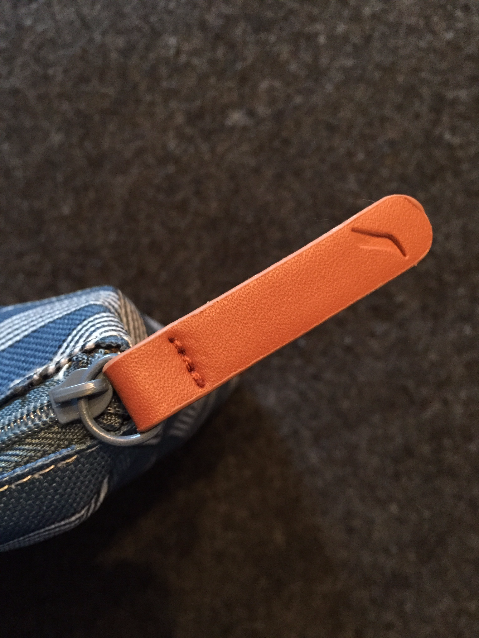 Leather zipper on amenity kit