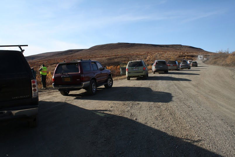 Odds are if there are more than 2 cars parked along the side of the road, it's not just some guy's pee break.