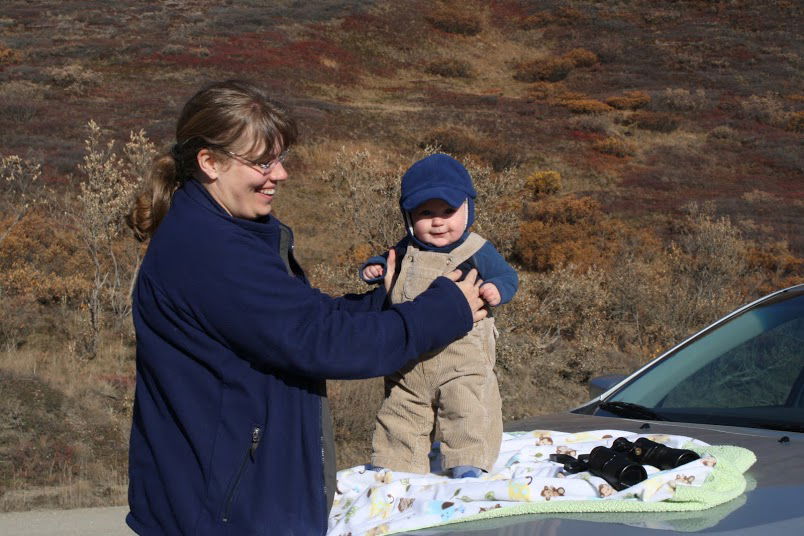 The binoculars are mandatory; the baby is optional.