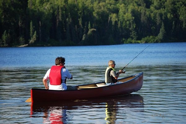 Fishing_from_canoe_on_lake