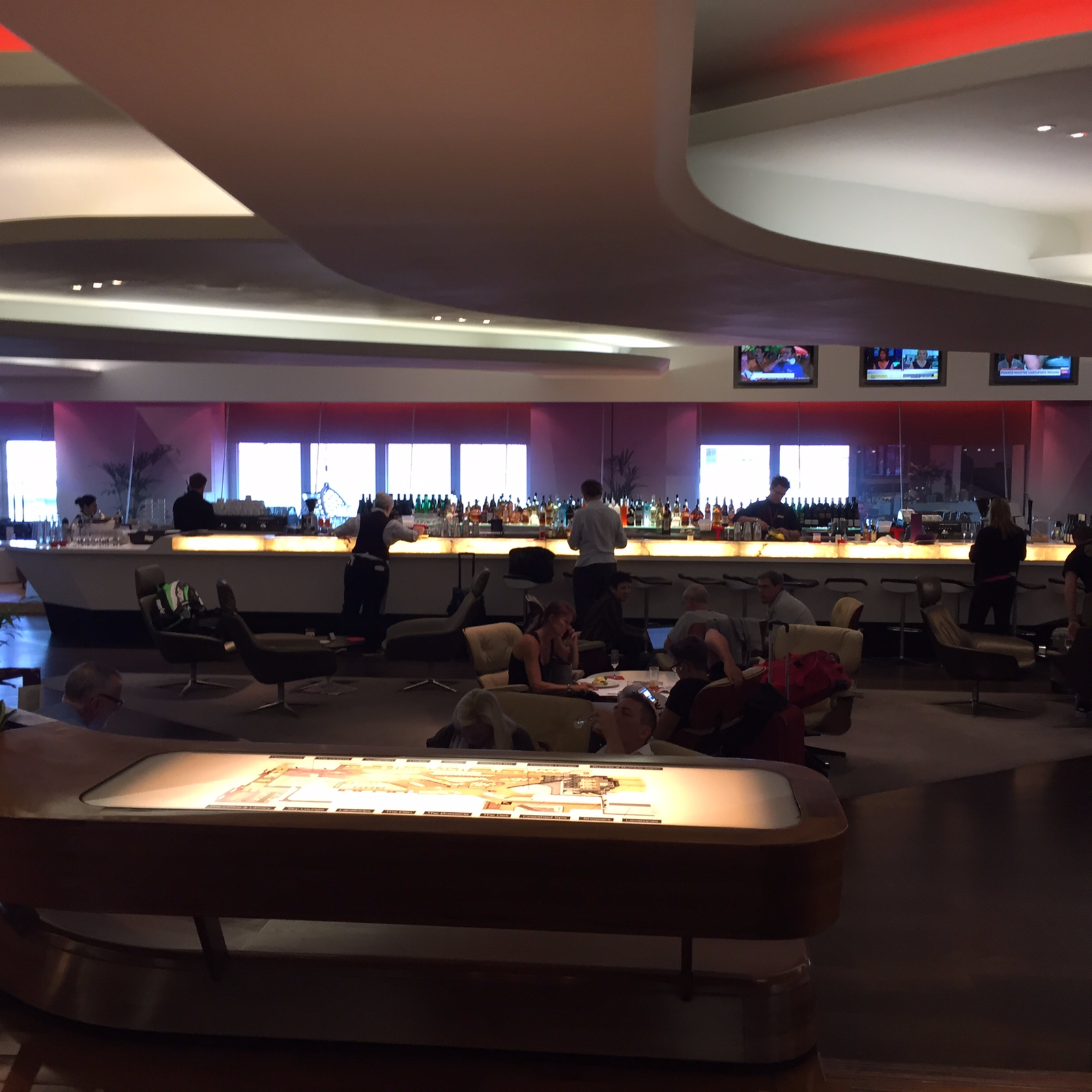 View of lounge upon entry with bar in the background