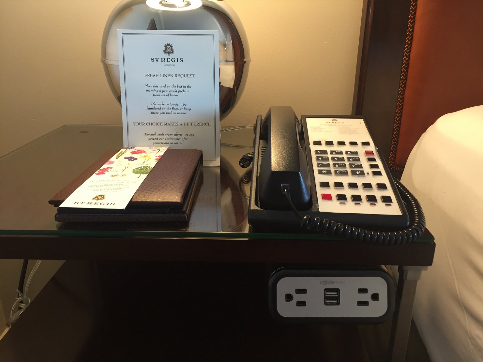 St. Regis Houston Grand Luxe Room bedside desk with charging area