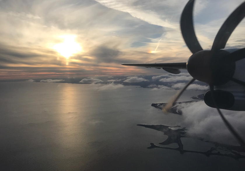 Porter Airlines plane on the ground at sunset