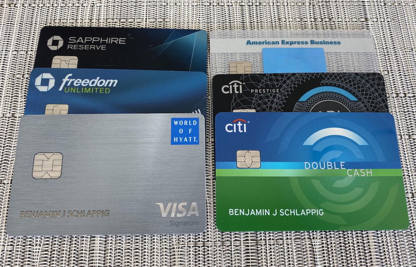 Assortment of physical credit cards spread out on a table