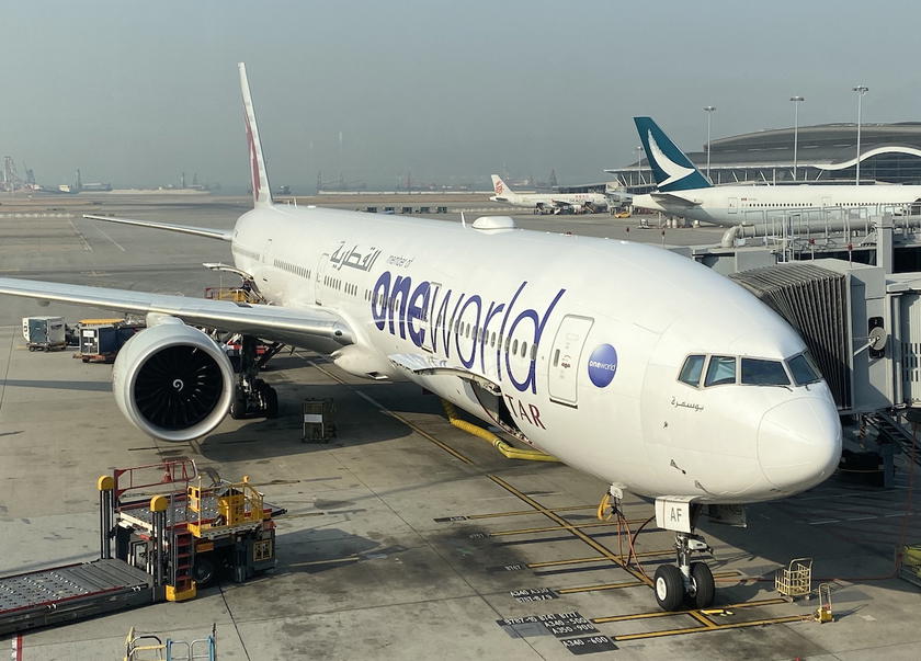 Qatar Airways Boeing 777 aircraft painted in Oneworld alliance livery on the tarmac