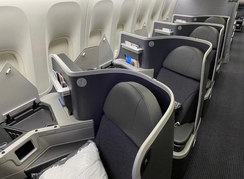 American Airlines 777 business class cabin, an example of elite status benefits earned through credit card spending