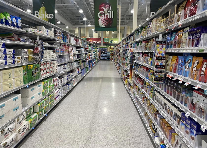 Shopping aisle in a supermarket stocked with groceries