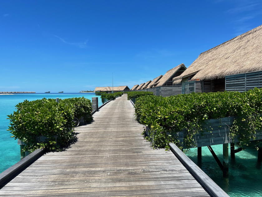 Waldorf Astoria Maldives resort with villas set above turquoise water