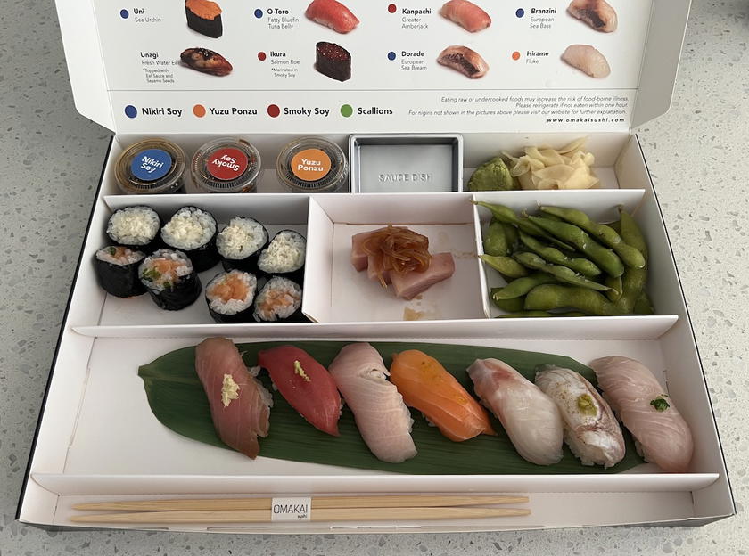 Food delivery bag being handed to a customer
