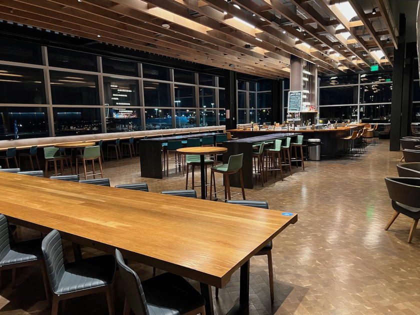 Seating and dining area inside the Alaska Airlines lounge in Seattle
