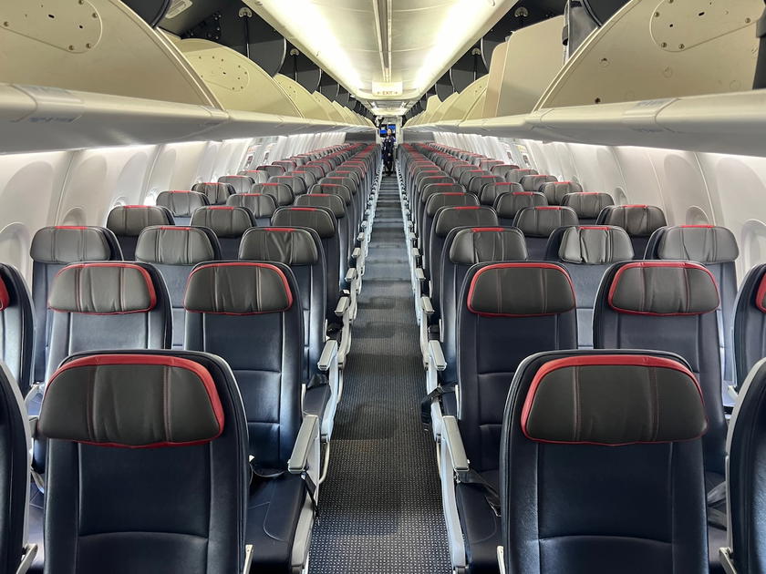 Interior of an American Airlines 737 first class cabin with rows of leather seats