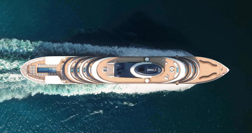 Exterior rendering of Four Seasons Yachts sailing near a coastline