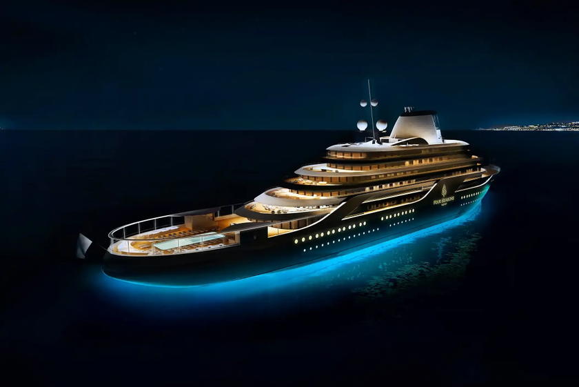 Four Seasons Yachts ship lit up at night while docked