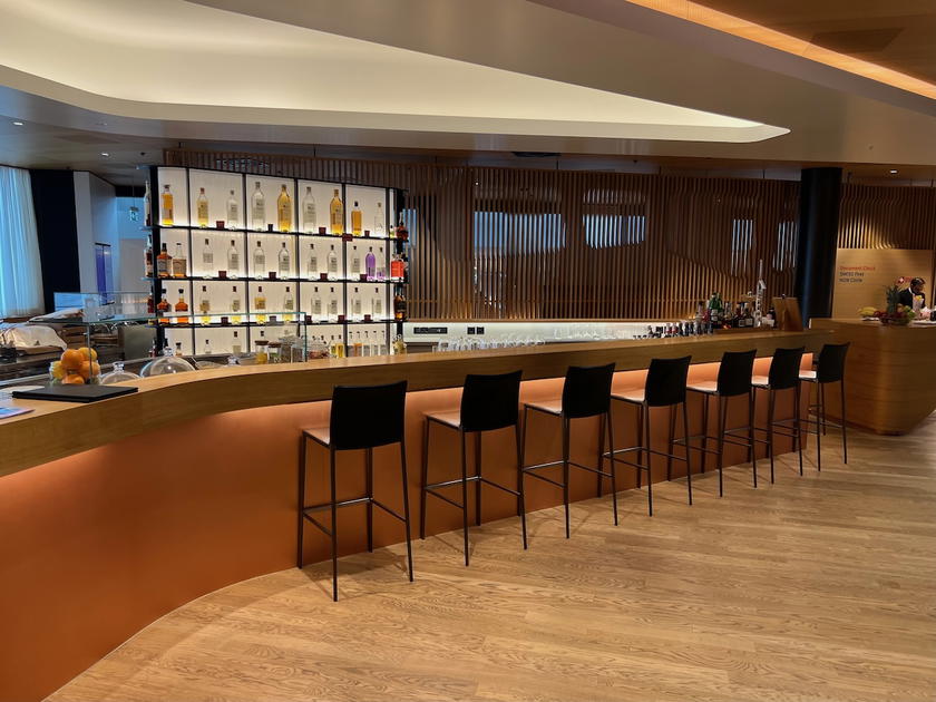 Bar area with bottles on display in the SWISS First Lounge Zurich Terminal A