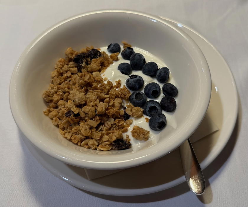 Homemade granola with fresh berries and honey served in the SWISS First Lounge Zurich