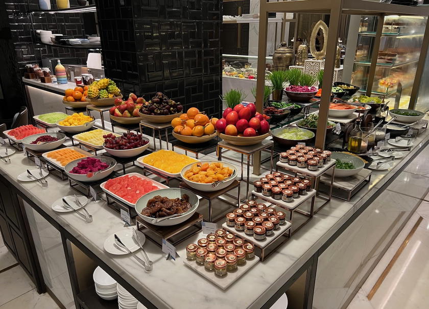 Dining area at the Waldorf Astoria Kuwait, where Hilton Gold members can enjoy complimentary breakfast perks