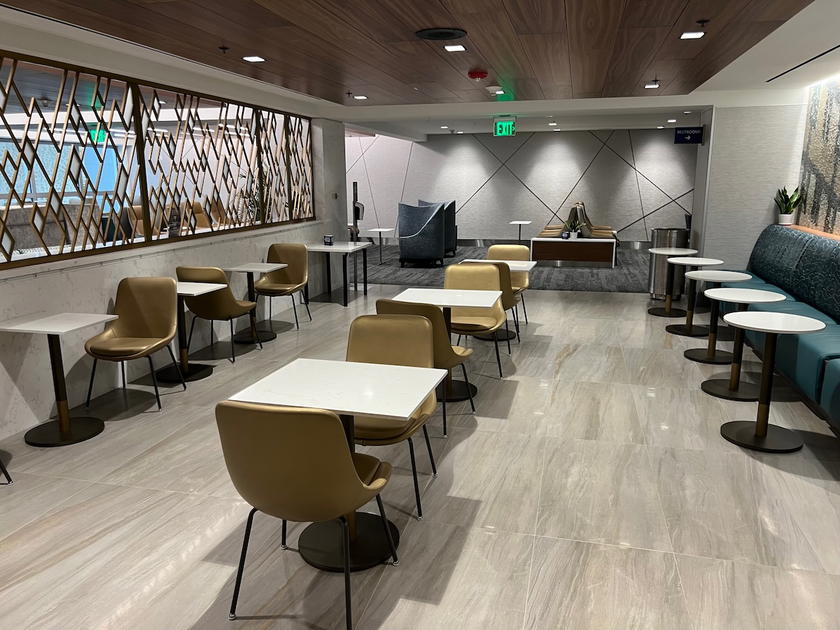 Seating area inside a Delta Sky Club lounge in Miami