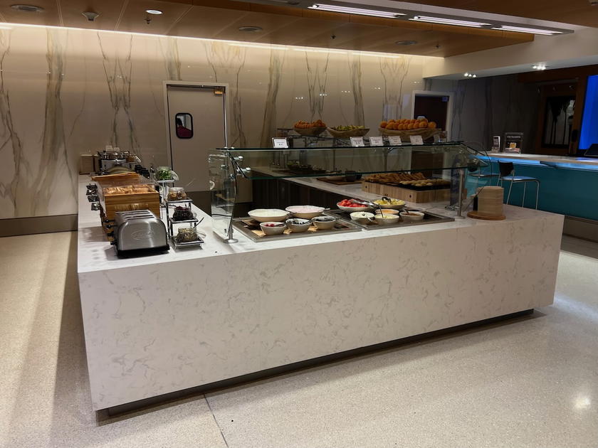 Buffet spread of food options at a Delta Sky Club in Miami