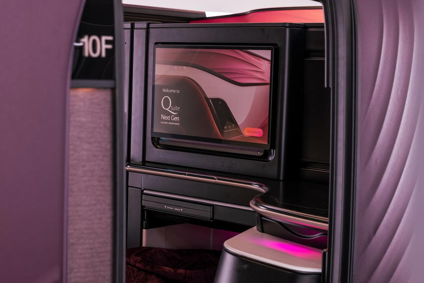 Qatar Airways Qsuite Next Gen business class suite set up for lie-flat sleeping