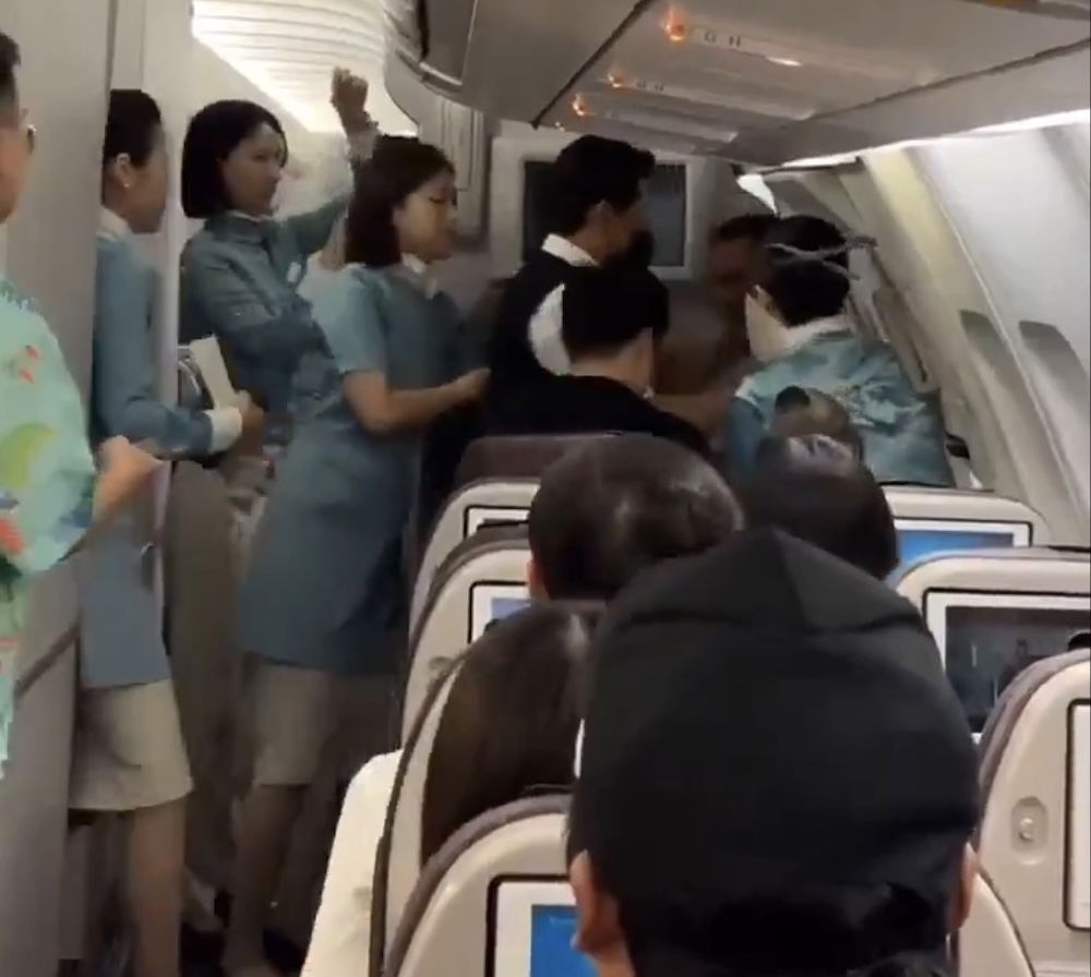 Korean Air Passenger Tries To Open Emergency Exit, Will get Restrained