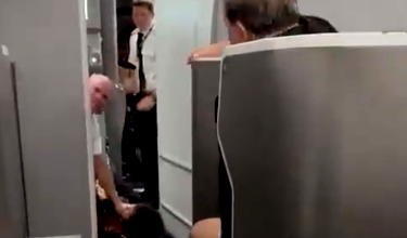 Oh My: Frustrated American Airlines Passenger Tackled By Flight Attendant