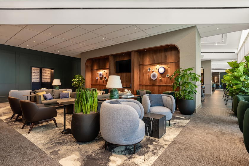 Cafe tables and high-top seating in the Amex Centurion Lounge Amsterdam