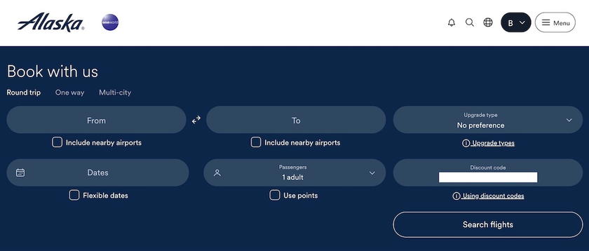 Alaska flight search page with the companion fare code applied and green checkmarks beside eligible itineraries