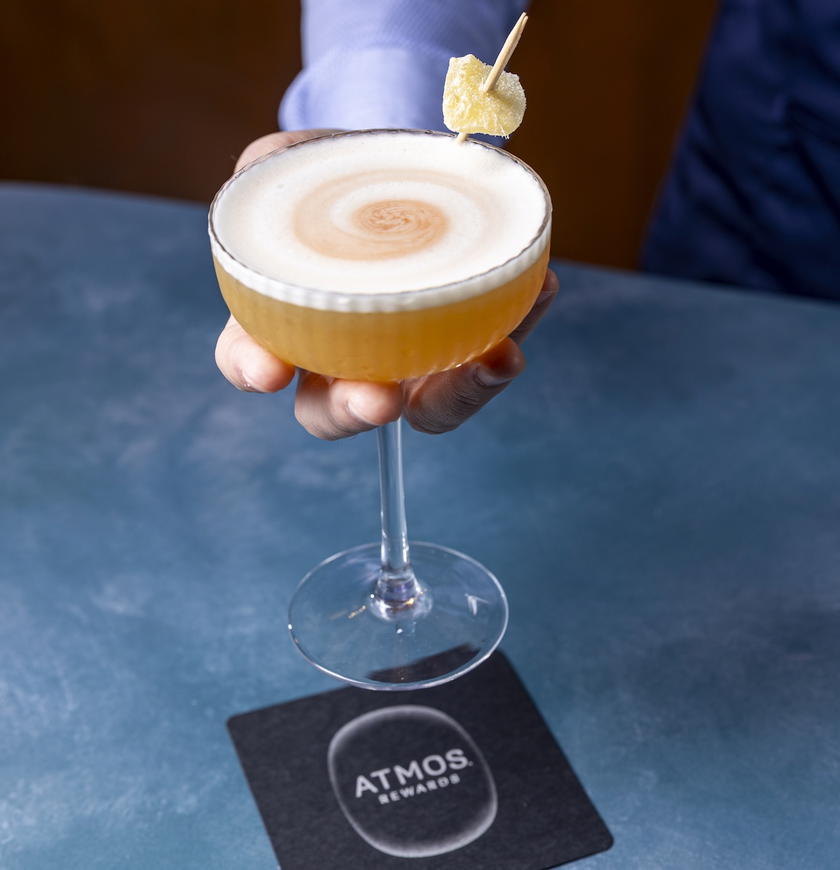 Bartender preparing a premium cocktail as part of the Alaska Lounge elevated bar program
