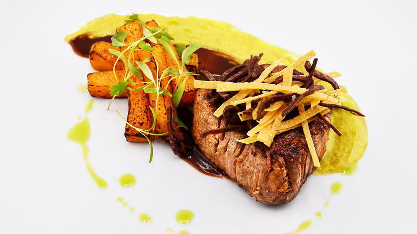 Mesquite-grilled beef filet plated as part of American's Flagship Dining menu