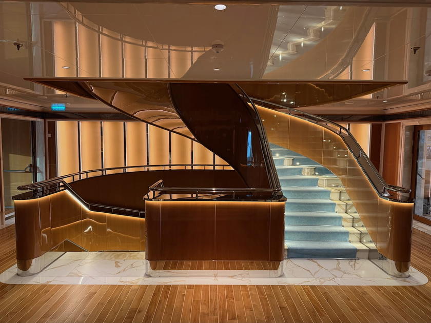 Grand staircase spanning several decks on Four Seasons Yachts