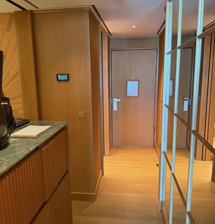 Entryway of a suite on Four Seasons Yachts with closet and bathroom to the side