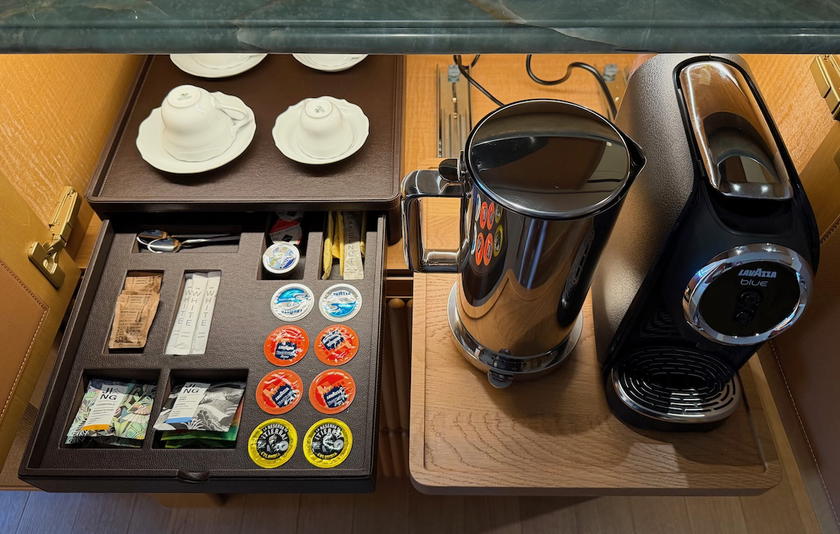 Minibar area with coffee machine and snacks in a Four Seasons Yachts suite