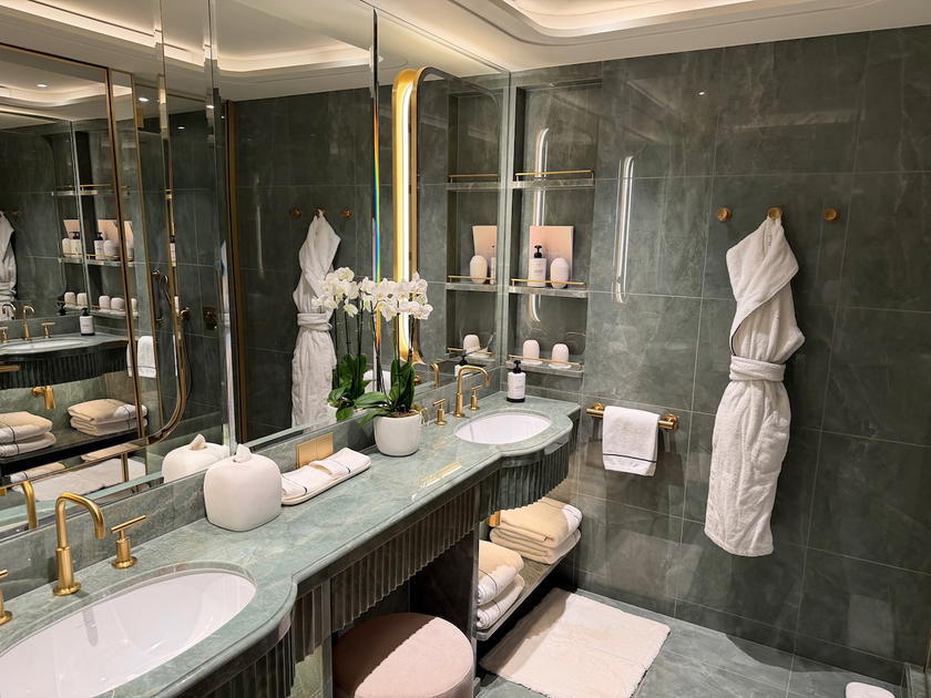 Bathroom in a Four Seasons Yachts suite with double sinks and walk-in shower