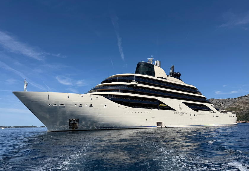 Four Seasons Yachts exterior showing the open stern area with the main pool