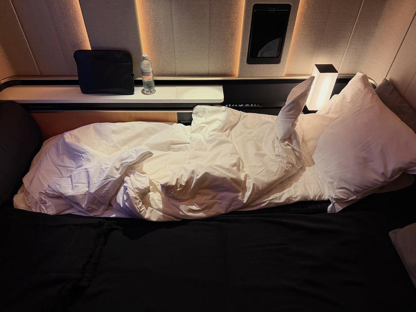 SWISS A350 first class suite converted into a flat bed with pillow and blanket