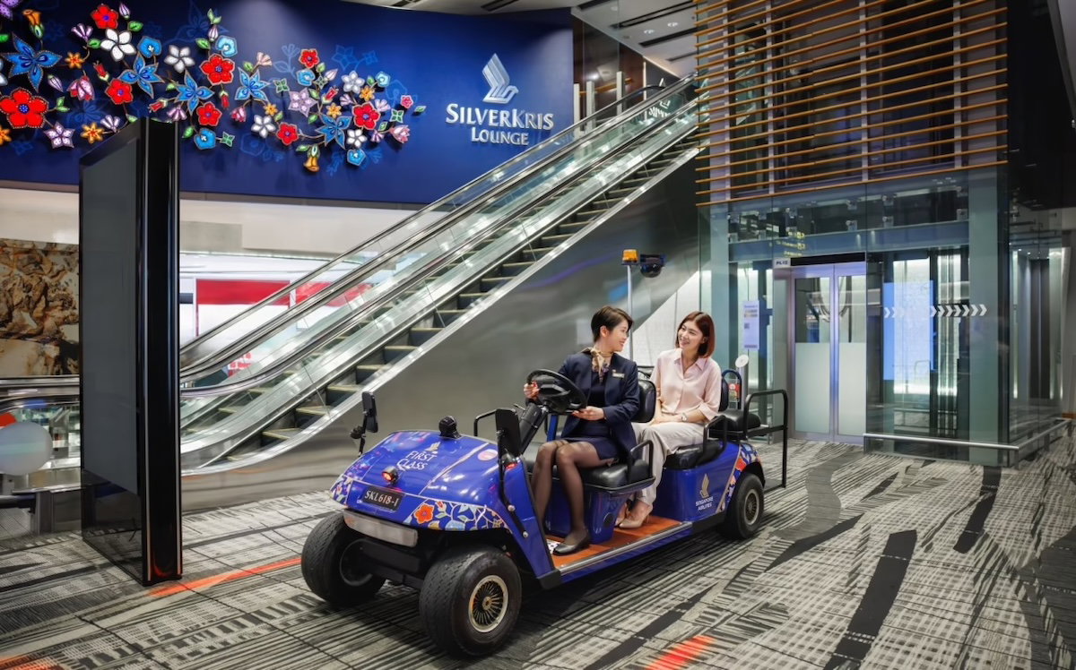 Singapore Airlines buggy carrying a first class passenger to the departure gate at Changi Airport