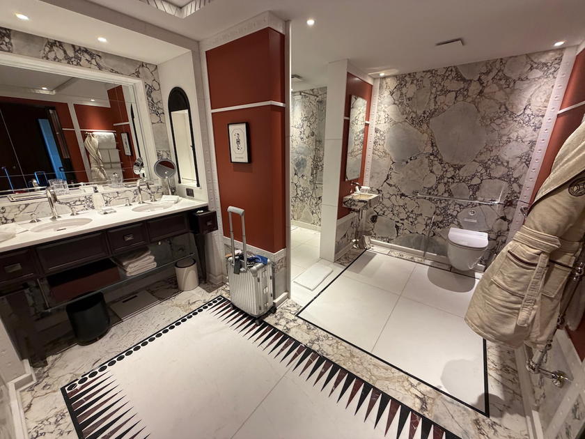 Bathroom with double sinks and walk-in shower in an Orient Express Corinthian suite