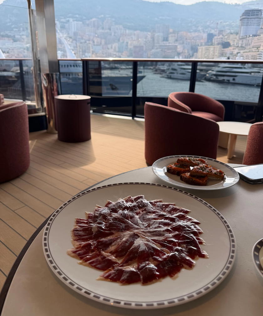 A beautifully arranged Ibérico ham platter served aboard Orient Express Corinthian
