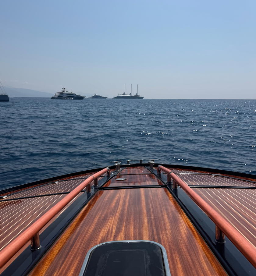 Guests aboard a Riva boat during Orient Express Corinthian's included outing