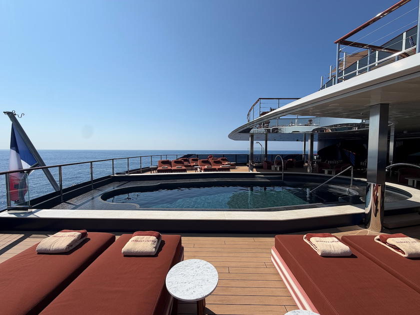 Pool with lowered water level exposing the tiled shallow shelf aboard Orient Express Corinthian