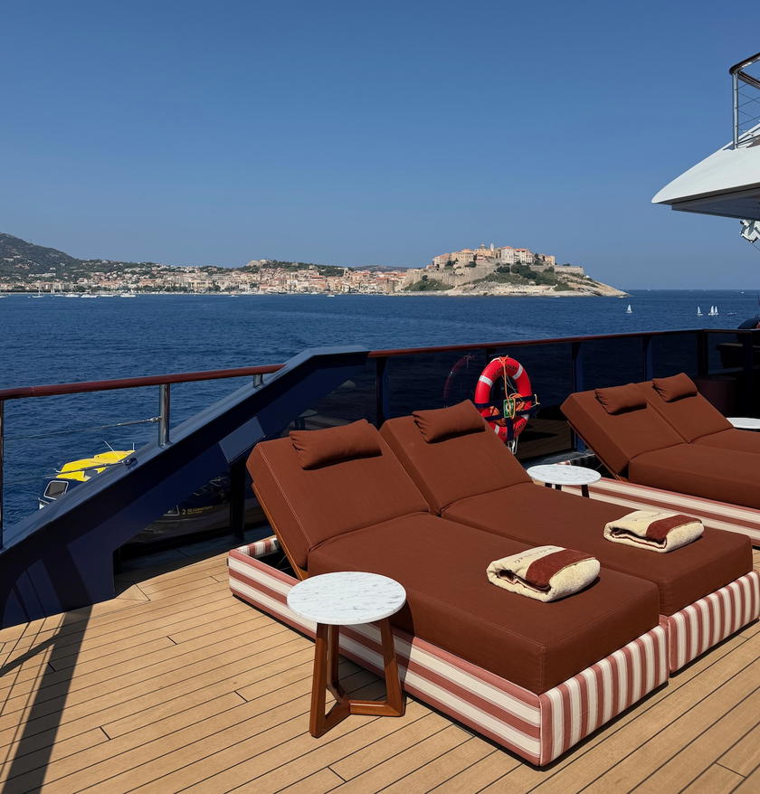 Loungers and outdoor seating on the deck of Orient Express Corinthian