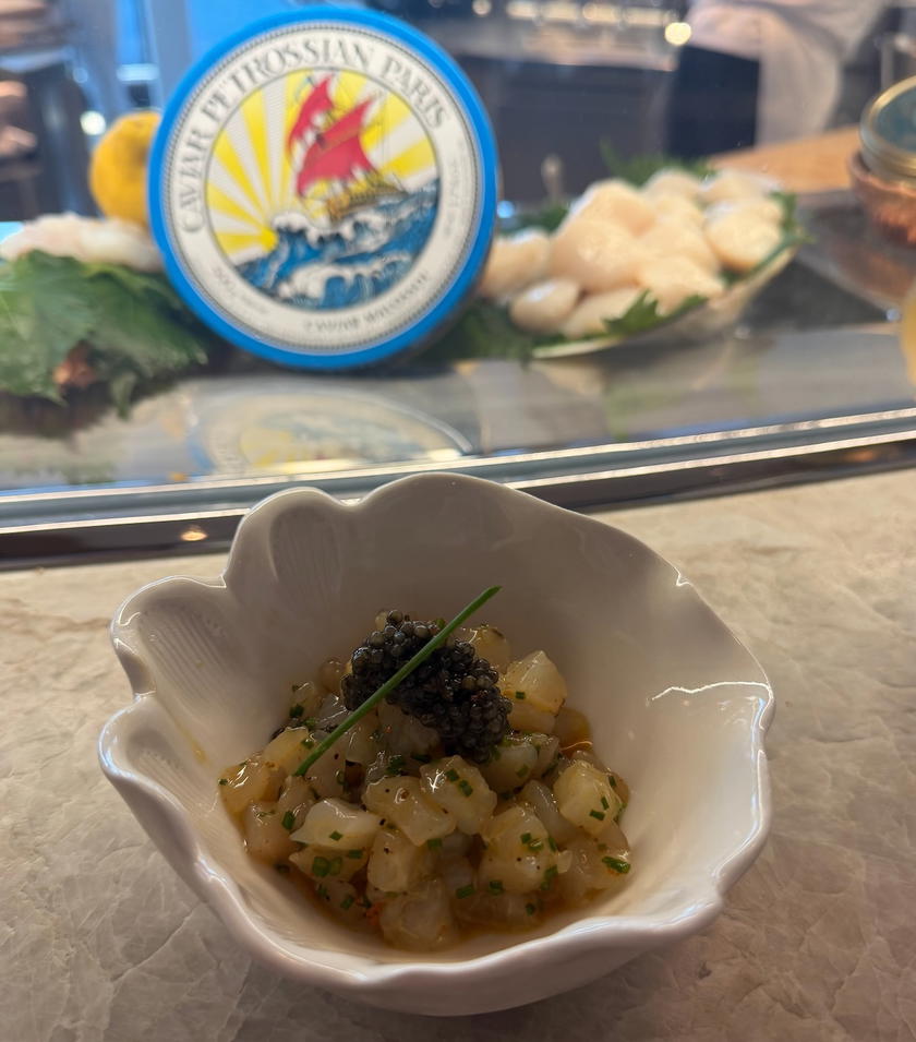 A seafood dish topped with caviar at L'Encre aboard Orient Express Corinthian