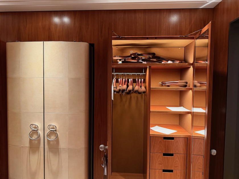 Open closet storage in an Orient Express Corinthian suite