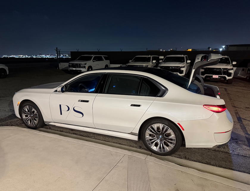 PS LAX chauffeur vehicle driving toward the Starlux Airlines aircraft at LAX