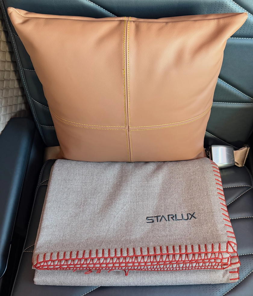 Leather pillow and Loro Piana blanket in Starlux first class