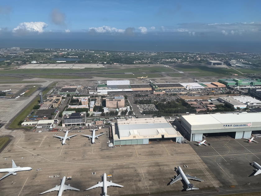 Clouds and landscape seen after takeoff from Taipei