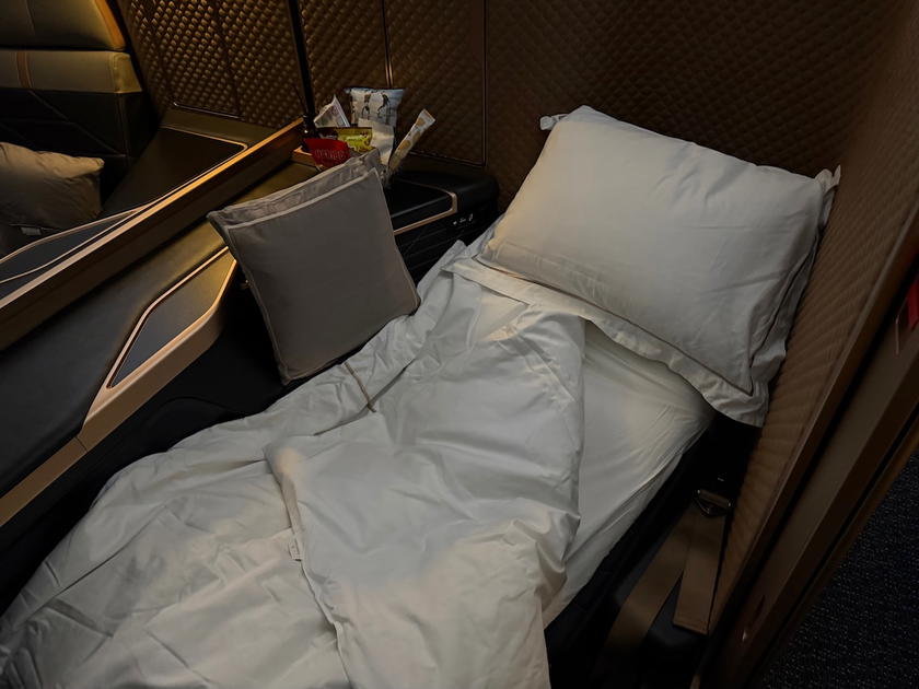 Fully made-up bed in Starlux Airlines A350 first class suite