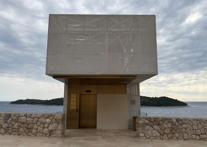 Exterior view of Villa Dubrovnik showing the entrance elevator built into the cliffside