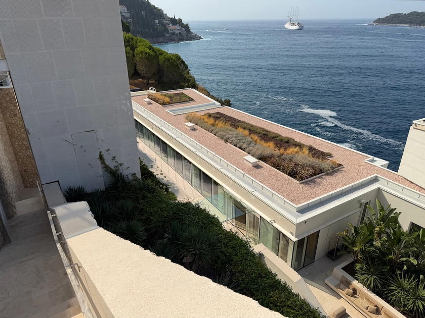 Aerial view of Villa Dubrovnik hotel built into a cliff overlooking the Adriatic Sea